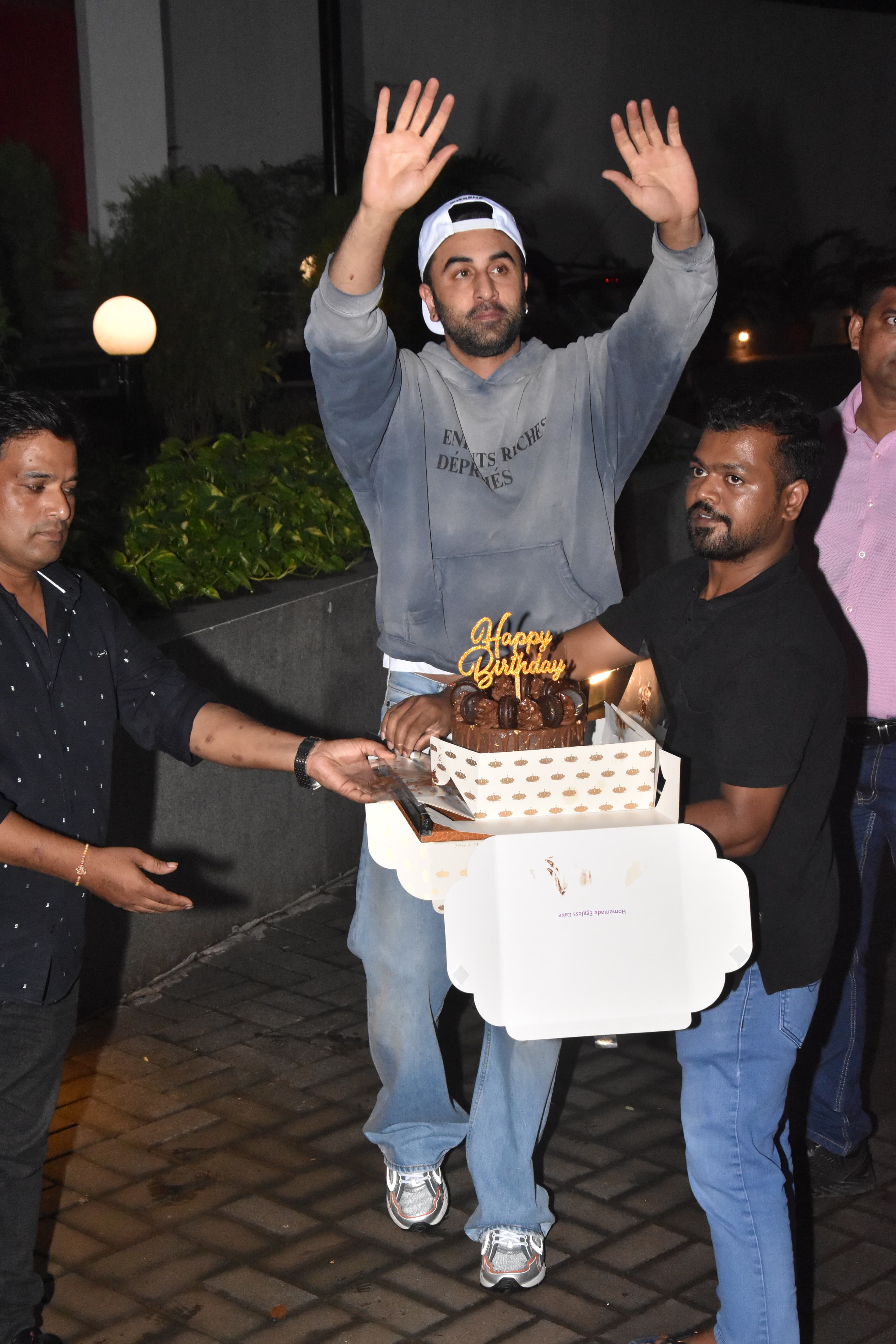 To their sheer delight, Ranbir emerged from his abode, holding a birthday cake, and joined his adoring fans in the celebration. 